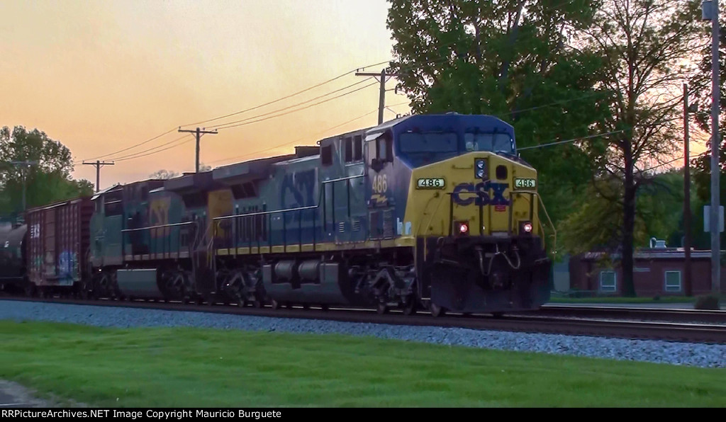 CSX AC44CW Locomotive leading a train